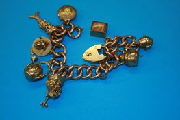 A gold charm bracelet. Weight 56.2 grams