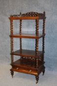 A Victorian rosewood 4 tier what not, the top with carved pierced fretwork, having barley twist
