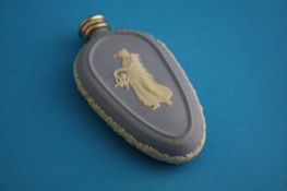 A lozenge shaped Wedgwood blue jasperware scent bottle decorated with a classical lady. 8 m long