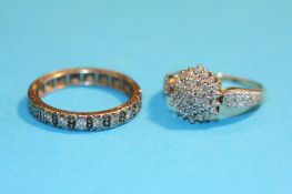 An 18ct white gold half hoop eternity ring and a 9ct gold diamond cluster ring.