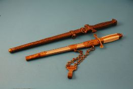 A Communist Era Officer`s dagger, three Russian medals and a modern German dagger.