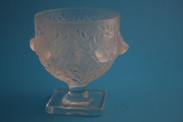 A Rene Lalique "Elizabeth" pattern frosted vase decorated with birds in trees, supported on a