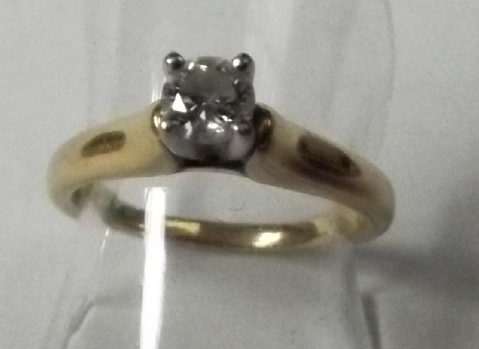 An 18ct gold solitaire ring set with quality .30ct diamond - size N, approx 5 grams in weight