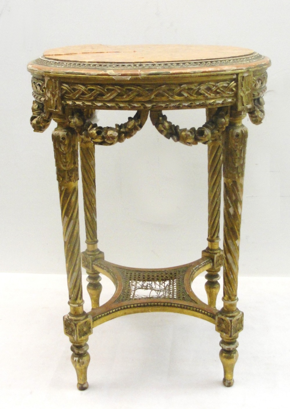 A Late 19th Century Giltwood and Marble Topped Circular Table:
the laurel swags suspended from a