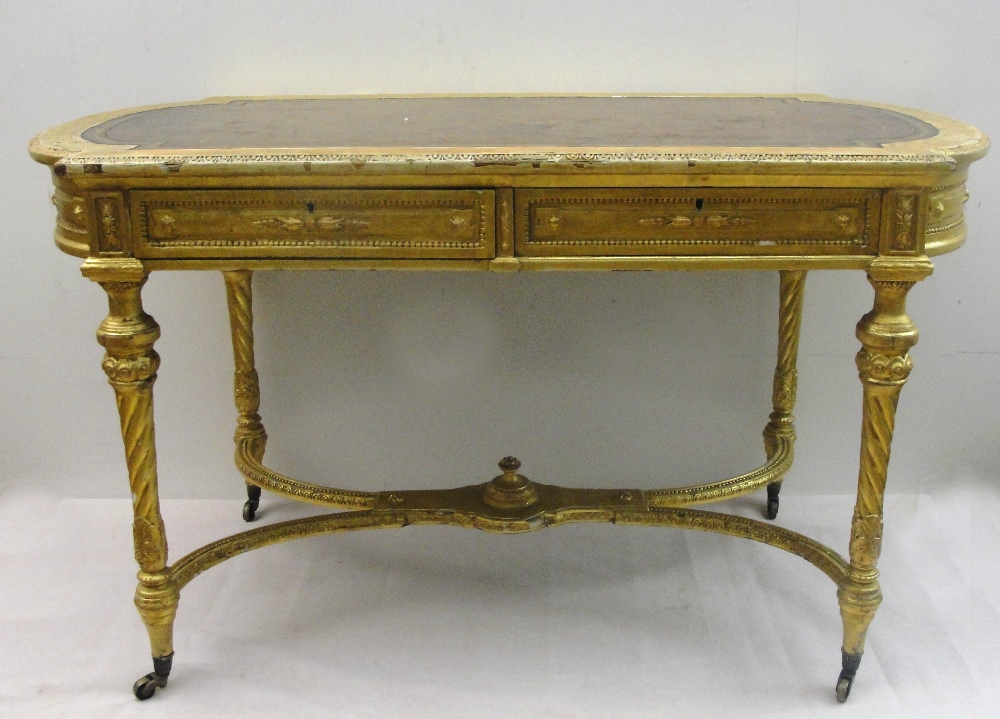 A 19th Century Shaped Rectangular Giltwood Desk in Louis XVI style:
the tooled red leather top