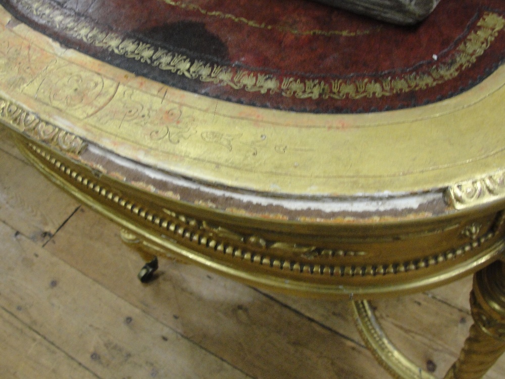 A 19th Century Shaped Rectangular Giltwood Desk in Louis XVI style:
the tooled red leather top - Image 5 of 10