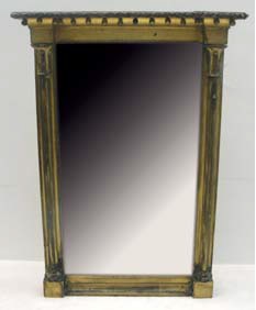 A Regency Giltwood Rectangular Overmantel Mirror:
the breakfront frieze decorated with balls; the