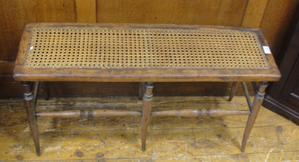 An oak rattan stool