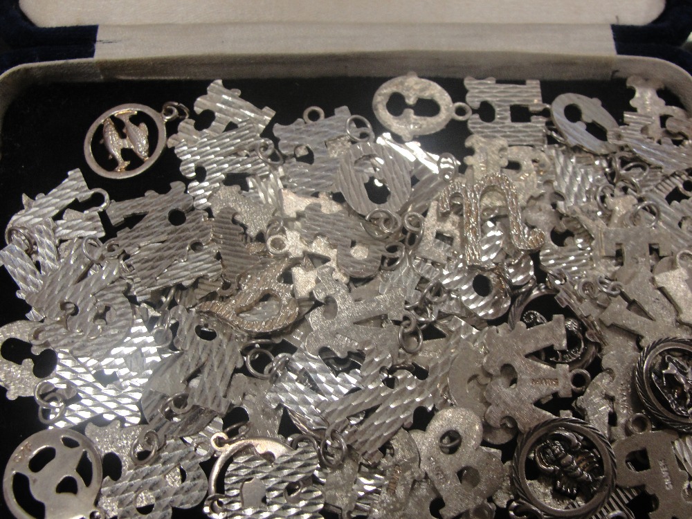 A bag of HM silver letter pendants & zodiacs