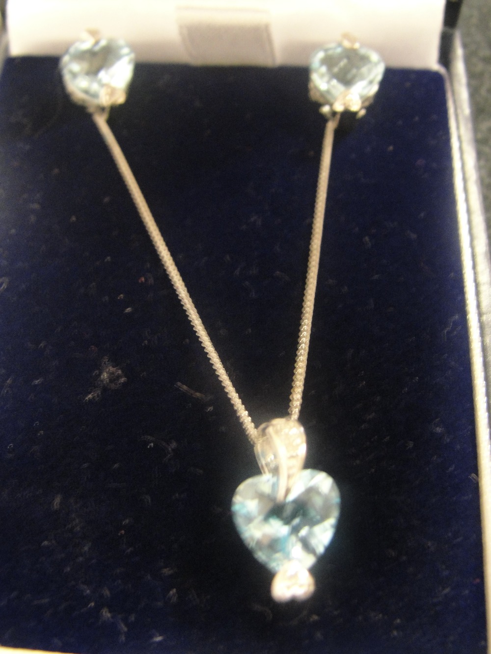 A 9ct topaz and diamond pendant; together with matching earrings