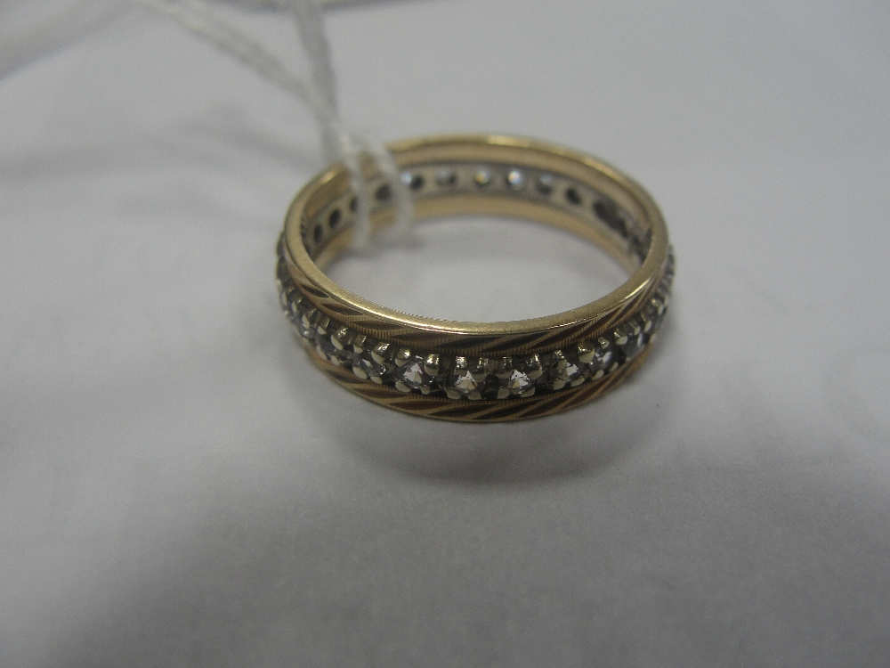 A 9ct and diamond eternity ring