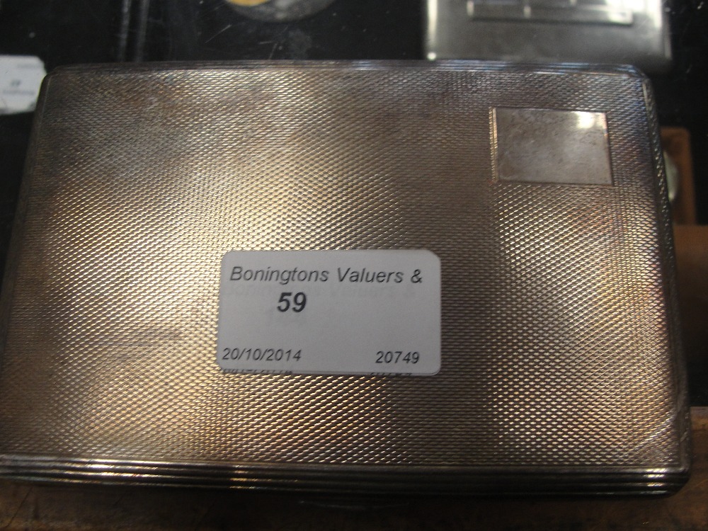 A large HM silver cigarette case