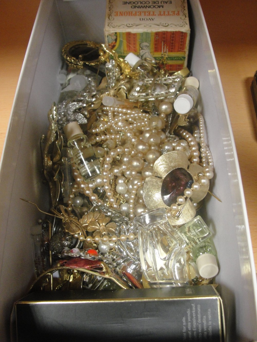 A quantity of dress jewellery and vintage perfumes