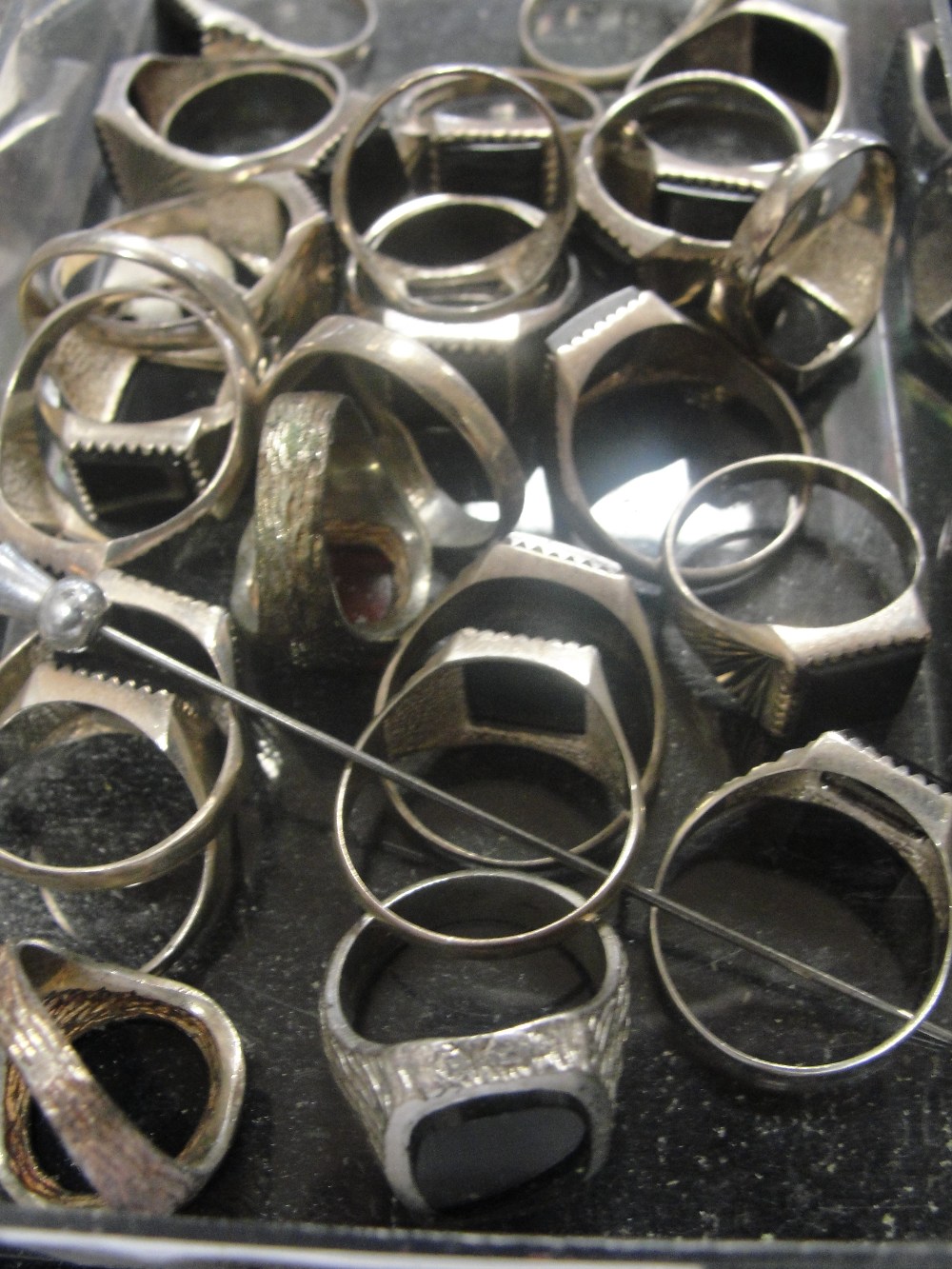 A large quantity of mens' silver hardstone rings