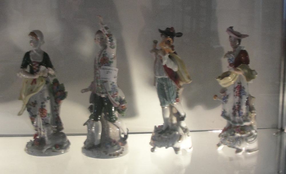 Four Sitzendorf porcelain figures: two maidens and two gentlemen, all with factory marks to base