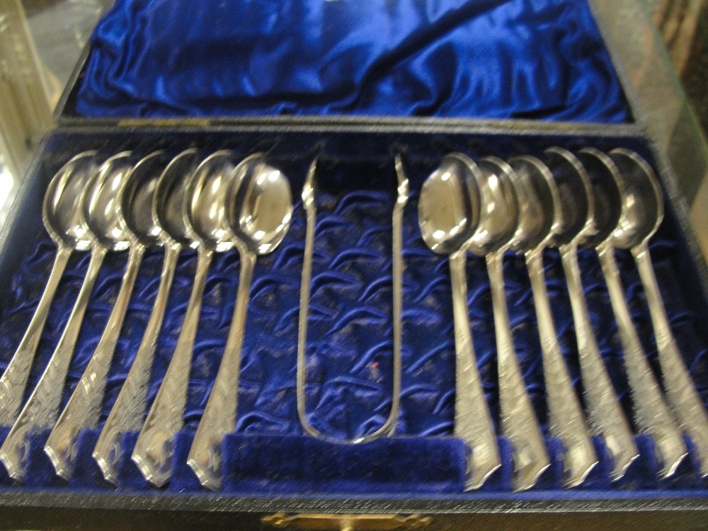 A cased set of HM silver spoons; together with sugar tongs