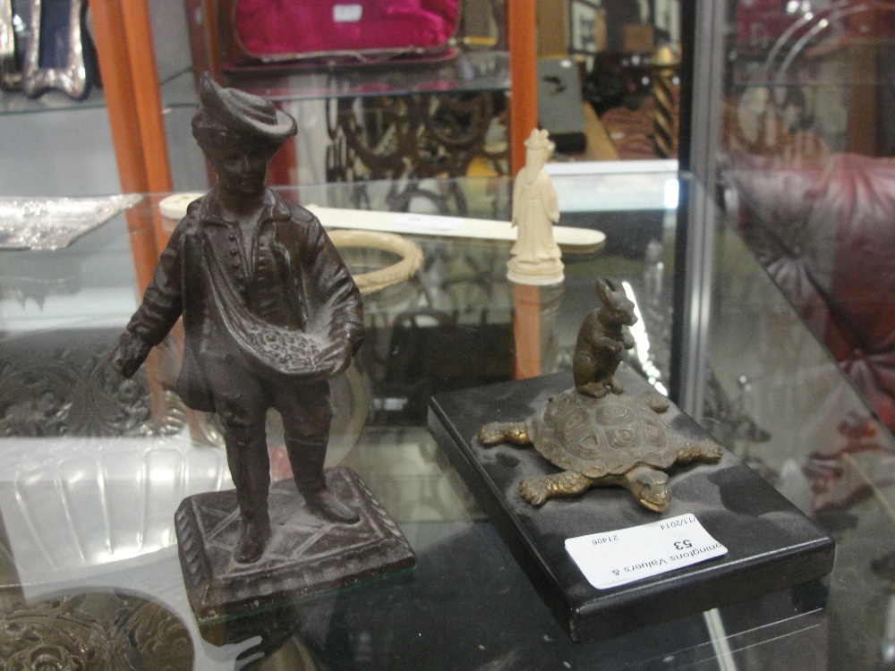 A bronze figure of a nobleman; together with a bronze tortoise and hare