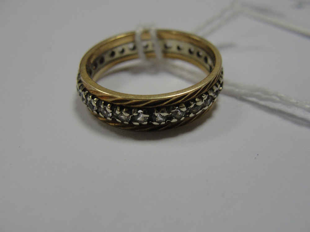 A 9ct and diamond eternity ring