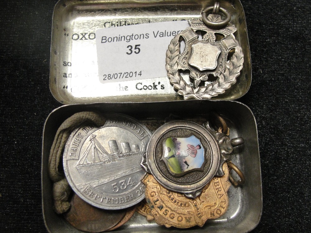 Two HM silver fobs to inc an enamelled footballer; together with Coronation medals