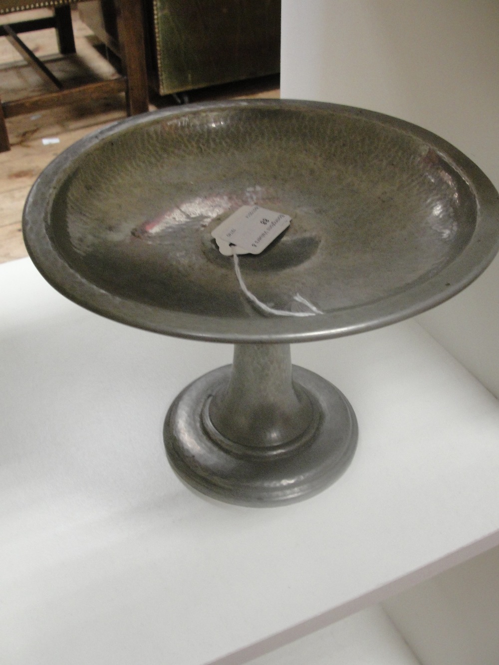 A Tudric Pewter Tazza:
a Tudric hammered pewter tazza.  The base is fully marked 'Tudric, English
