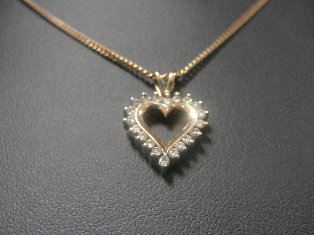 A 9ct chain with diamond heart pendant