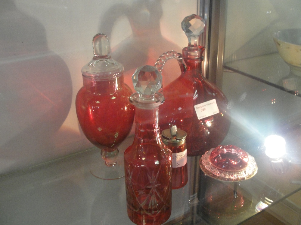 19th/20th century ruby/cranberry glass decanters; together with lidded pots