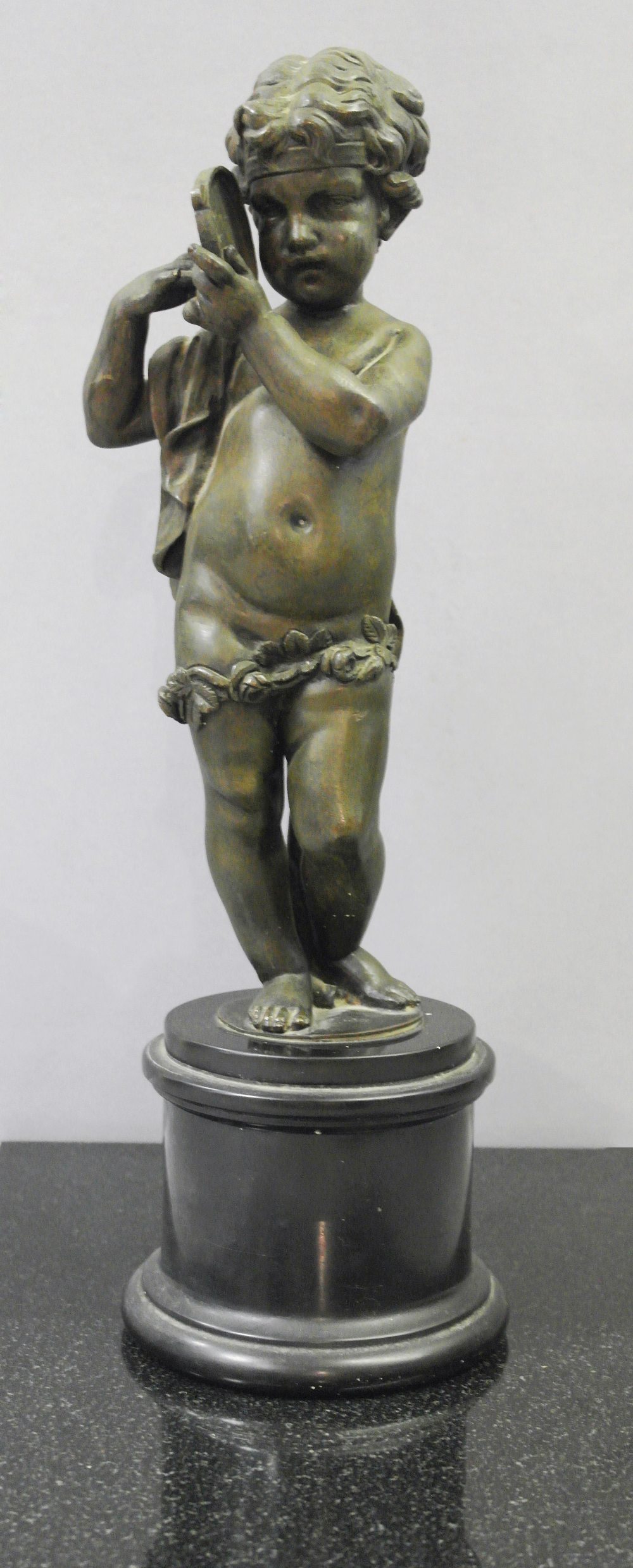 A 19th Century Bronze Putti:
a large 19th century Neo-Classical bronze of putti playing a tambourine