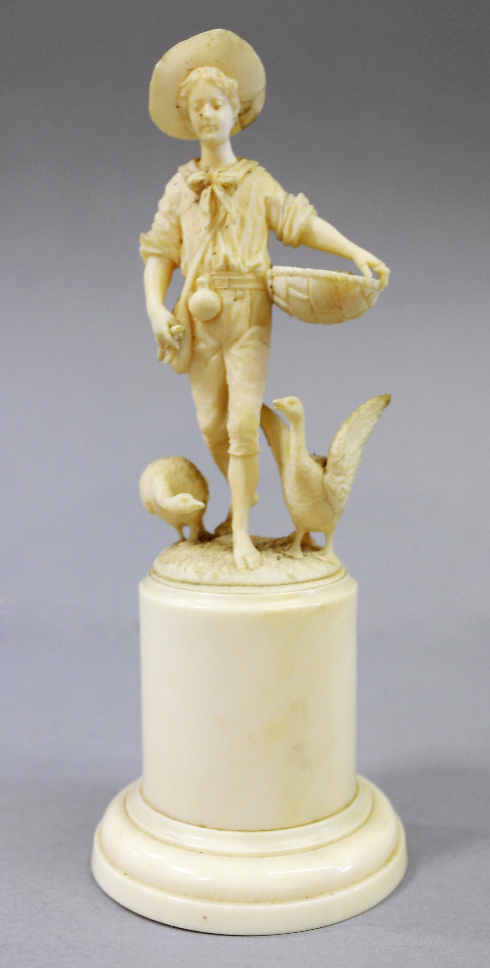 A European ivory carving
19th century
Representing a boy carrying a wicker basket under his left arm