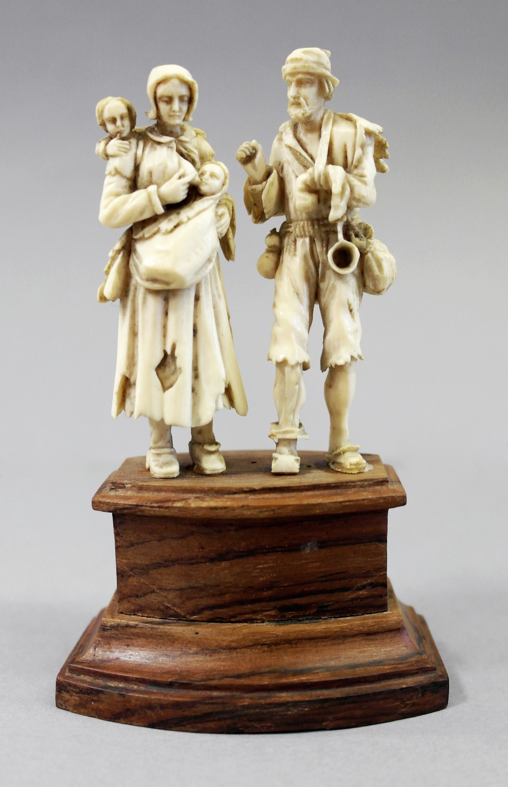 A European ivory carving
19th century
Representing a peasant family to include an injured man and