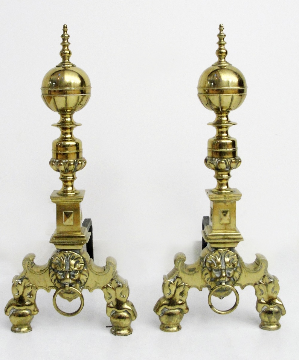 A pair of firedogs:
19th century, brass with turned finials on brass feet