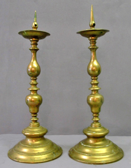 A Pair of 18th Century Dutch Brass Pricket Candlesticks:
of large size with turned body with