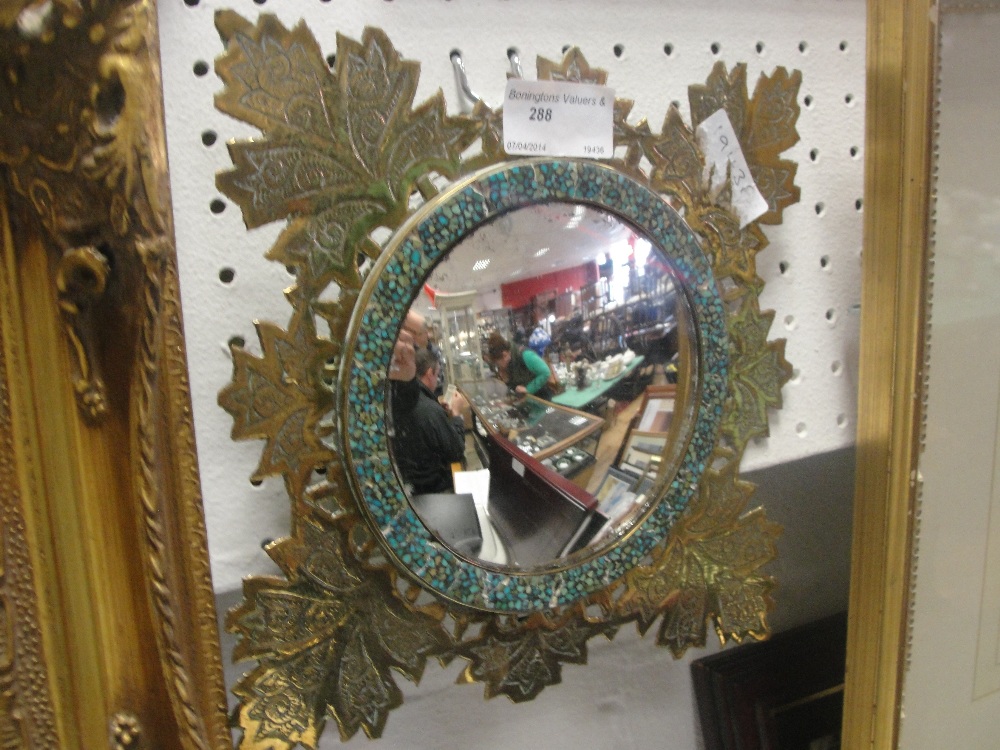 An Anglo-Indian turquoise set brass mirror