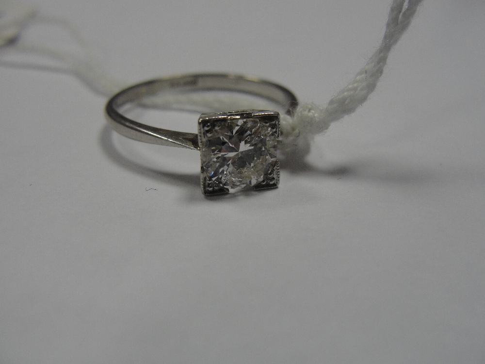 An 18ct and platinum Deco style diamond solitaire approx. .71ct