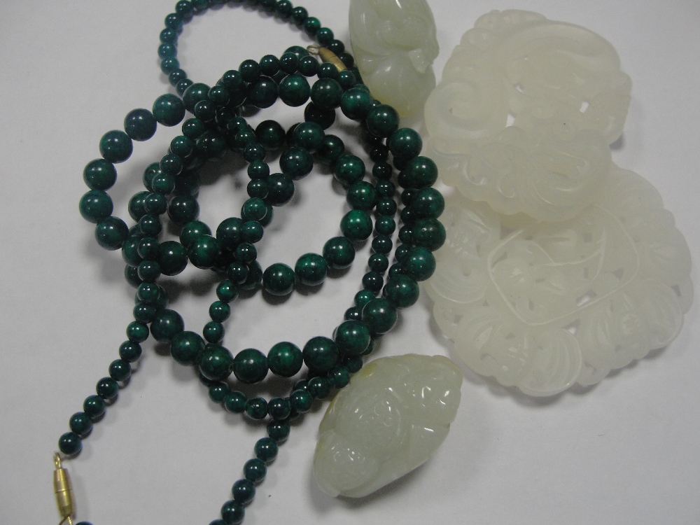 Two carved jade pieces; together with two jade pendants and two jade hardstone necklaces