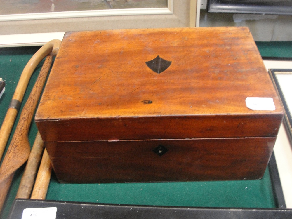 A 19th century writing slope with bone dominoes and a chess set