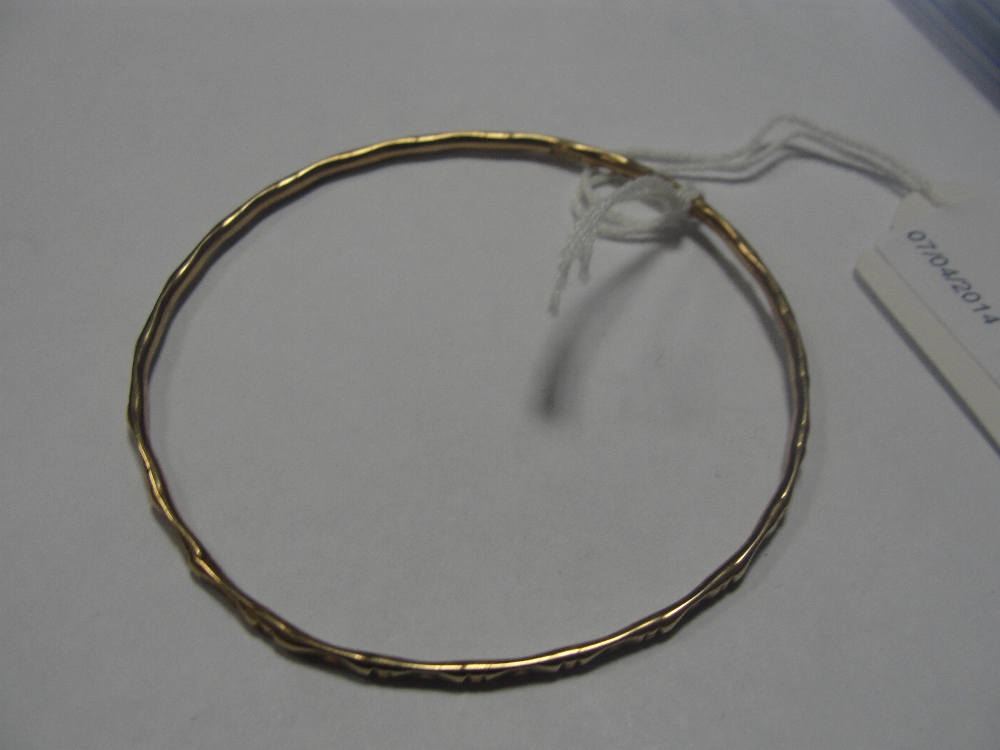 A 9ct bangle