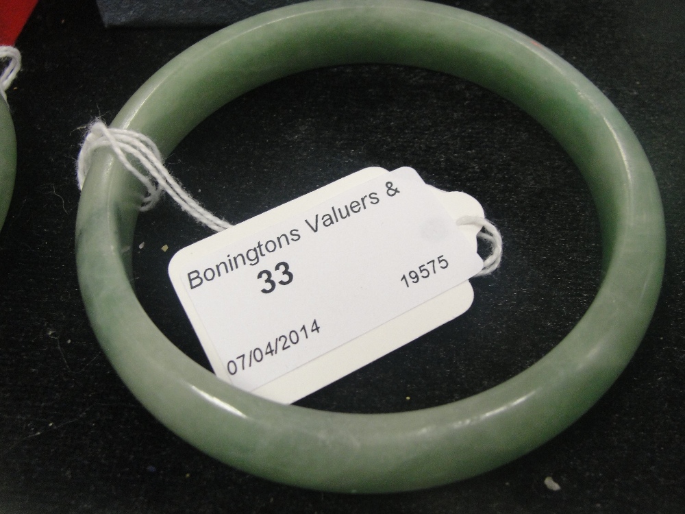 A light green jade bangle