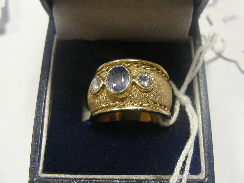 An 18ct diamond & saphire set dress ring