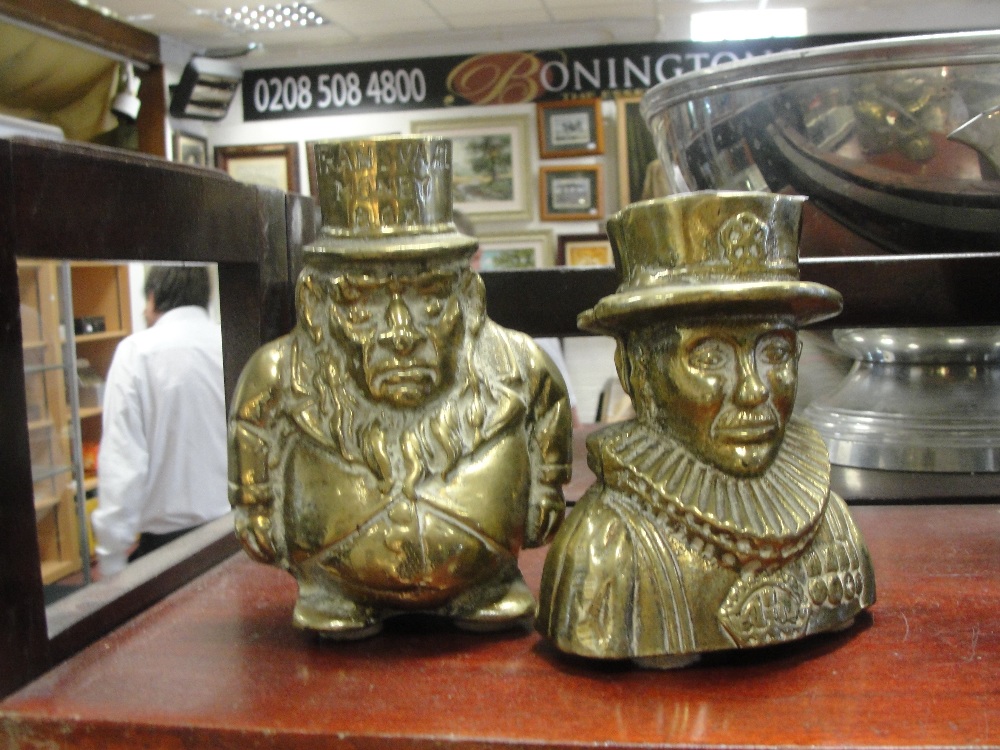 A pair of brass money boxes