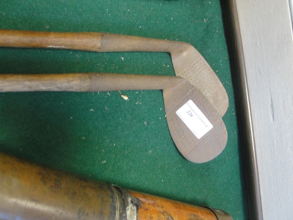 Two golf clubs: Grant Andersons, Mashie & Nibuck