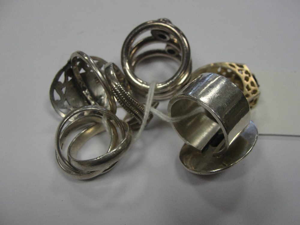 Six silver dress rings