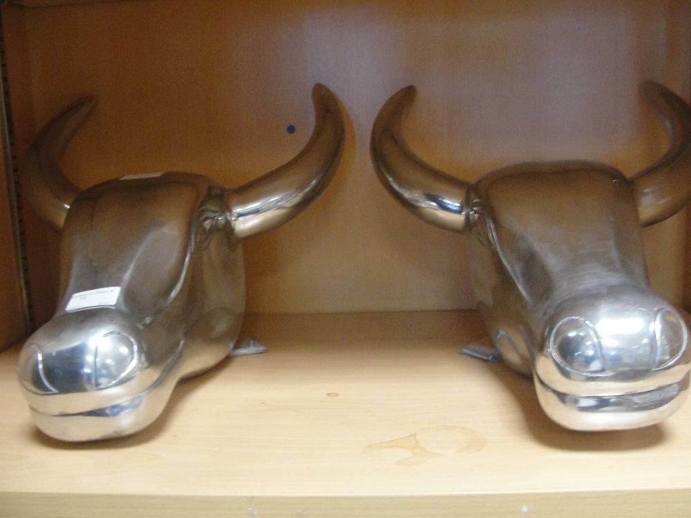 Two chrome bulls heads