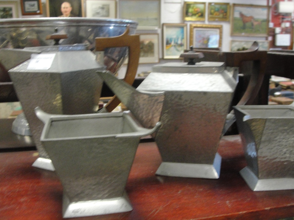 An Arts & Crafts pewter hammered tea set