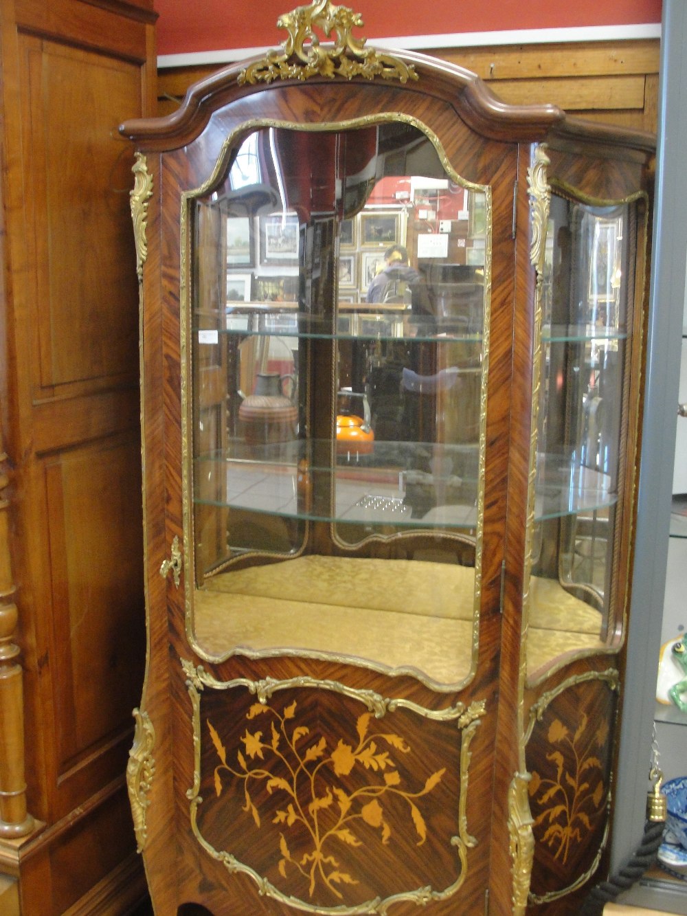 A marquetry rosewood Louis XVI style vitrine with brass mounts