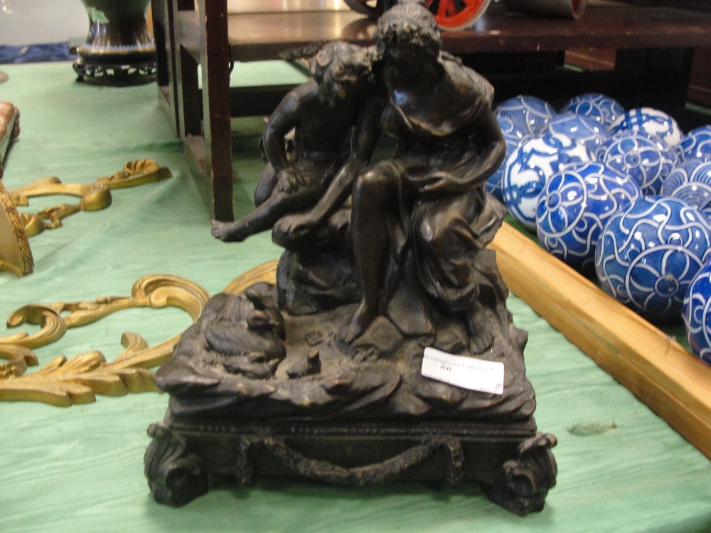 A bronze figure of  mother and child signed J. Peacey