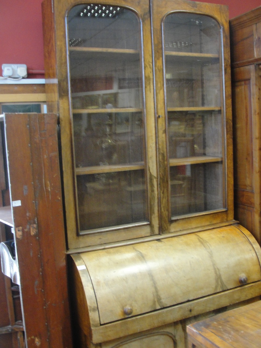 A 19th century walnut roll-top bureau bookcase