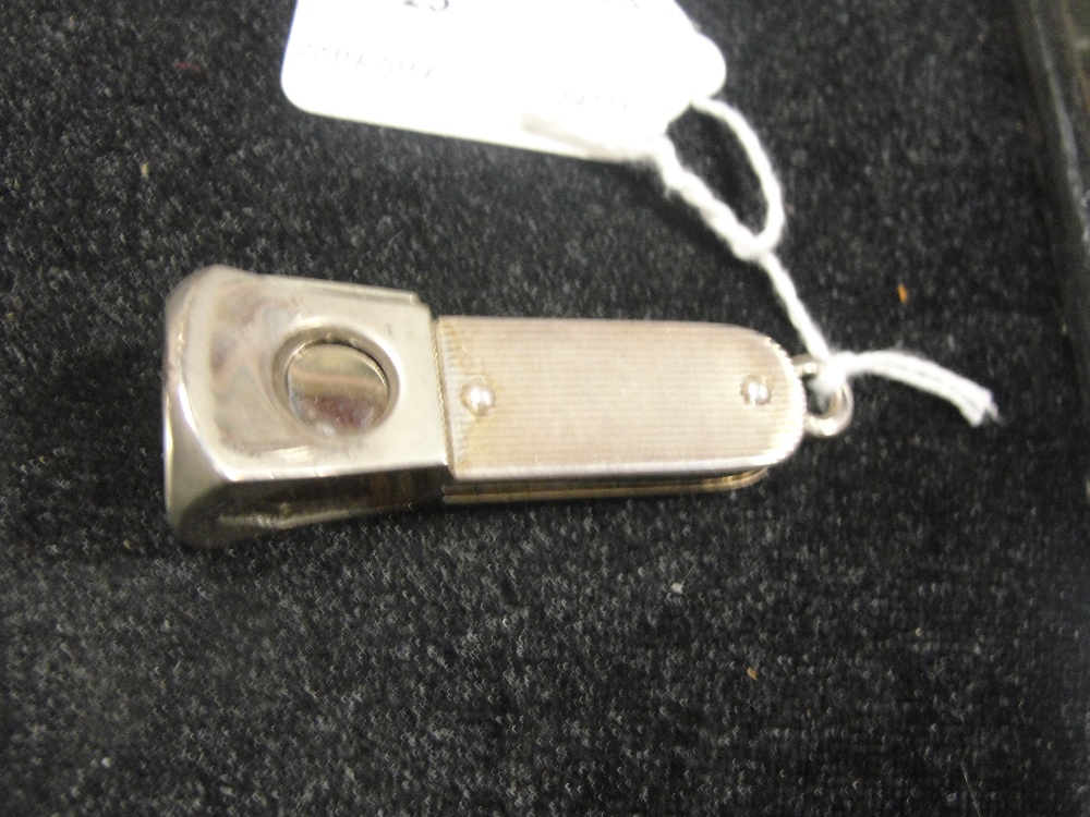 A silver-sided cigar cutter