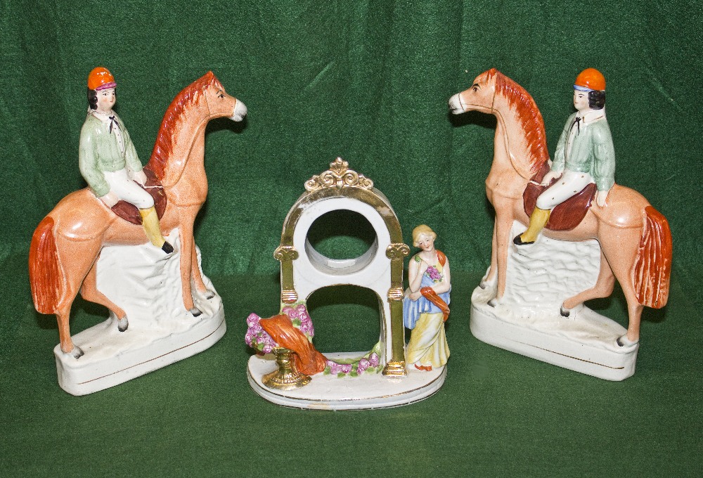 A pair of 20th century Staffordshire figures a/f and a porcelain watch stand