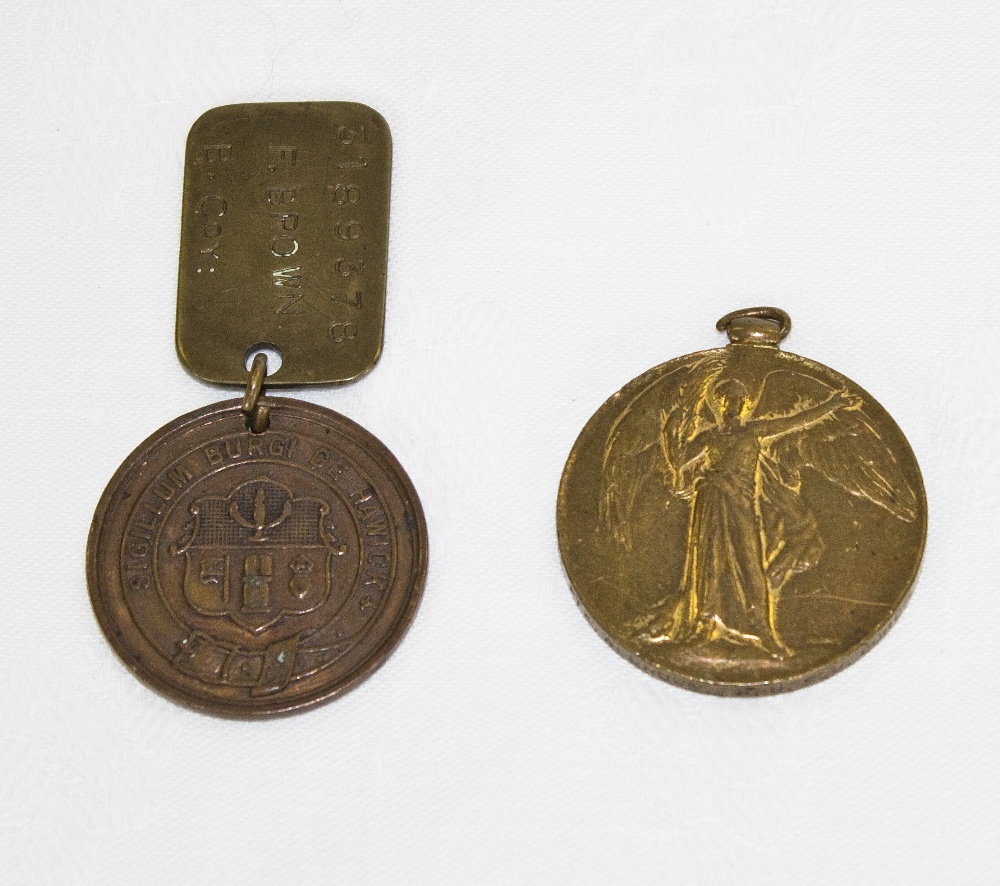 A WWI Victory medal assigned to Pte A Brown KOSB together with a WWI Hawick Peace medal and dog tag