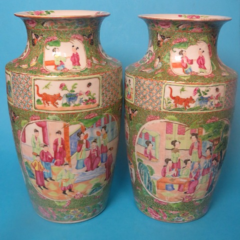A pair of 19th century Chinese Canton famille rose vases of shouldered form with everted rims,